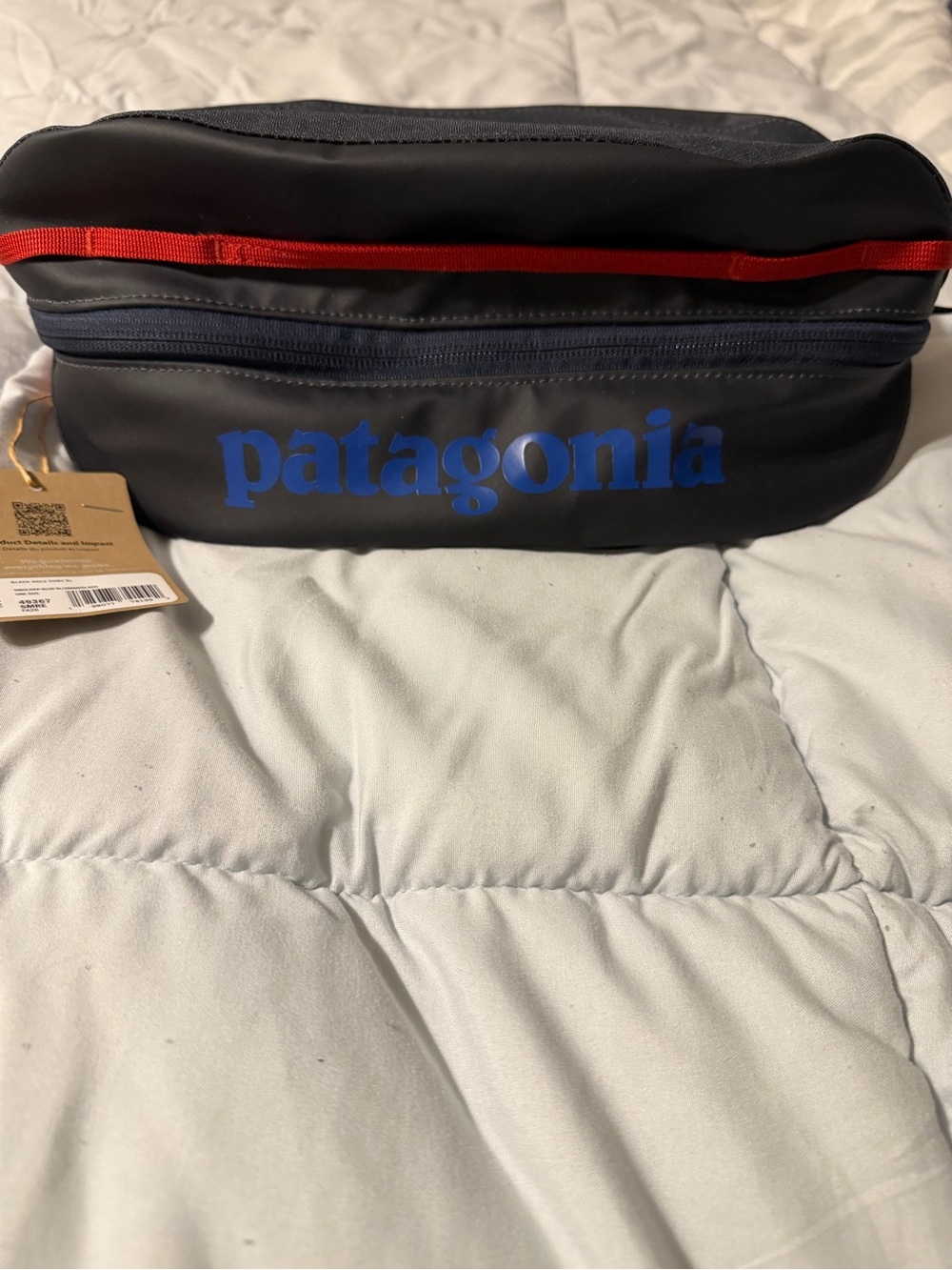 Patagonia Black Toiletry Bag with Blue Logo and Red Trim